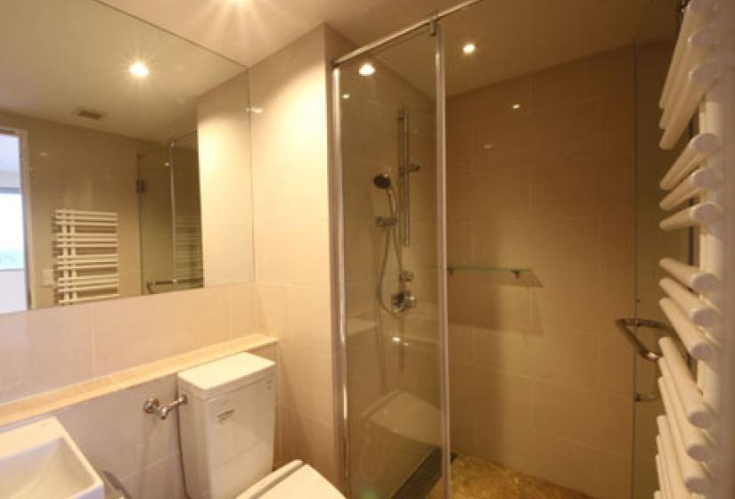 shower with electronic toilet in bathroom