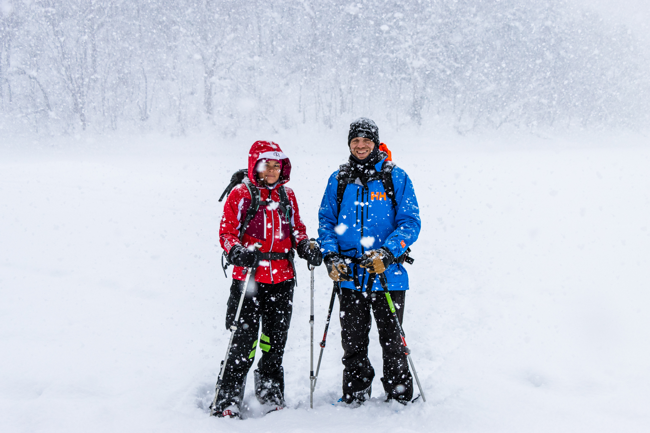 Happy skiers with lift passes heading to slopes