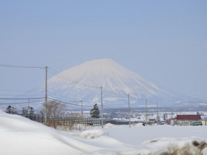 A view of Mount Yotei intersected by powerlines