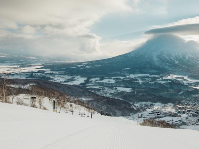 The view across a groomed slope with Mount Yotei in the back ground.