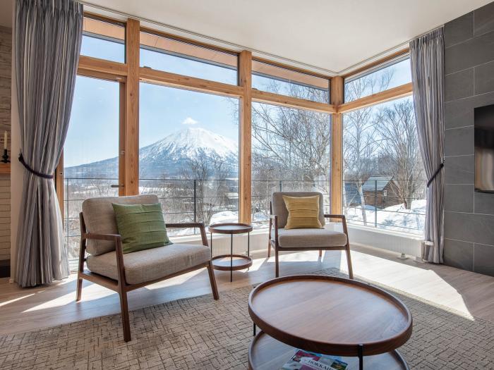 Lounge area with Yotei view Two sets in front of large window with mountain view