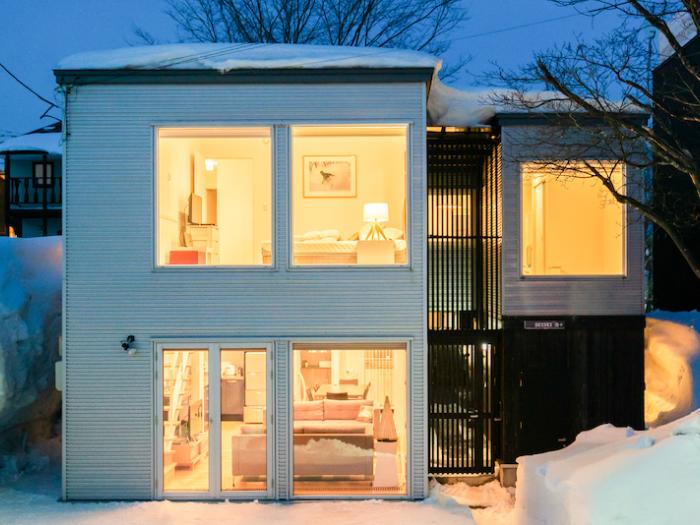 The exterior of a 2 story house at night