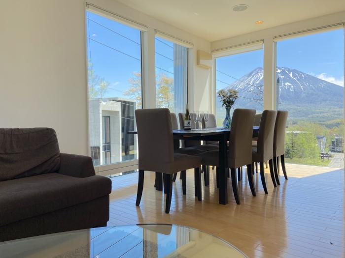 A dining table with mountain view behind.