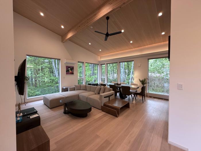 A lounge suite with table and windows behind