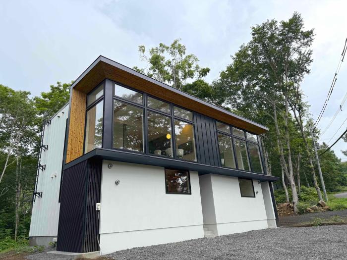 The extrerior of a black and white townhouse