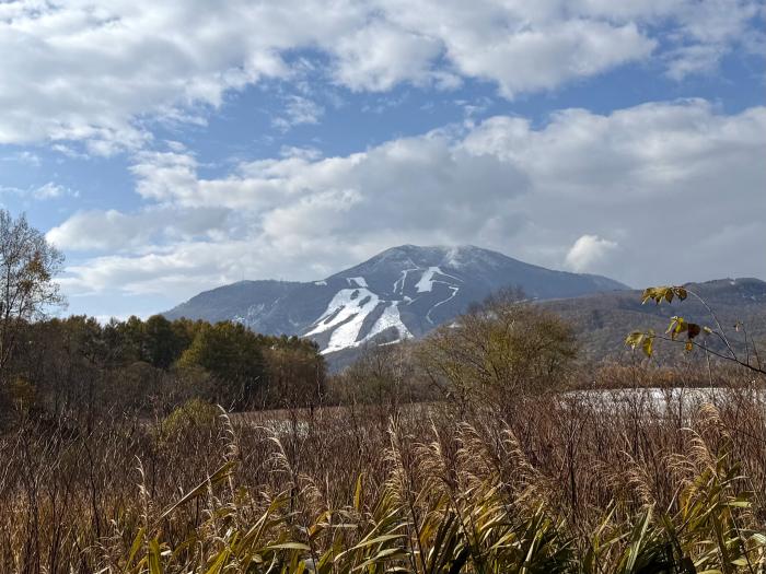 A snow speckled hill from a distance