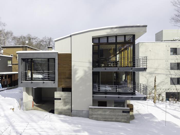 The exterior of a two story building with a curved roof