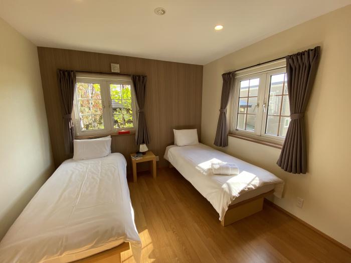 Two made up single beds