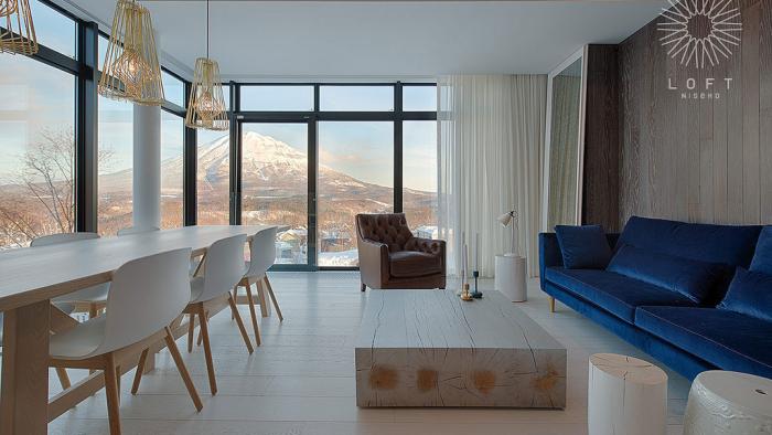 floor to ceiling windows offer Mt. Yotei view from the living room
