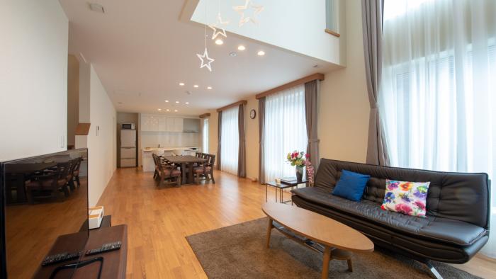 living area with black sofa