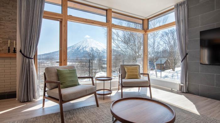 Lounge area with Yotei view Two sets in front of large window with mountain view