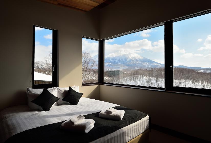 large bed with many windows and yotei veiw