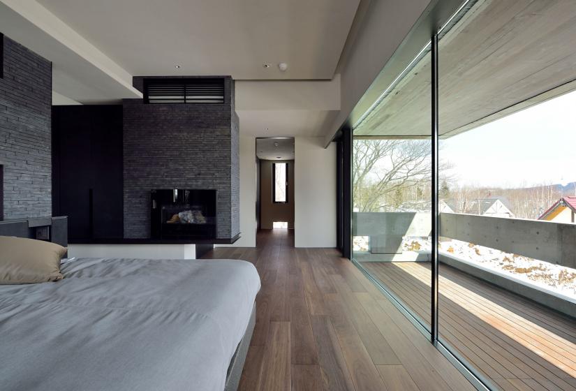 bedroom with fireplace and stellar view