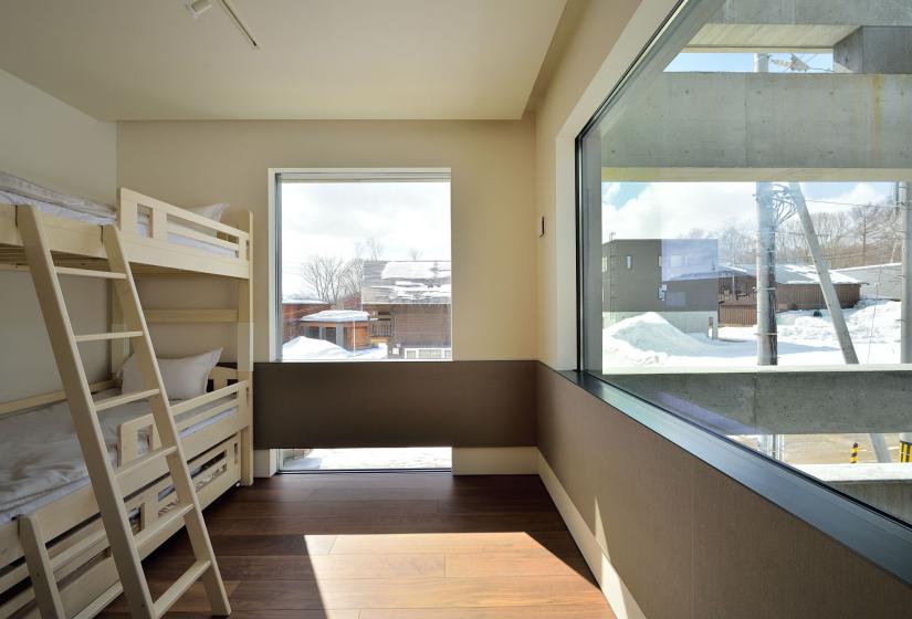 bunks room with large window