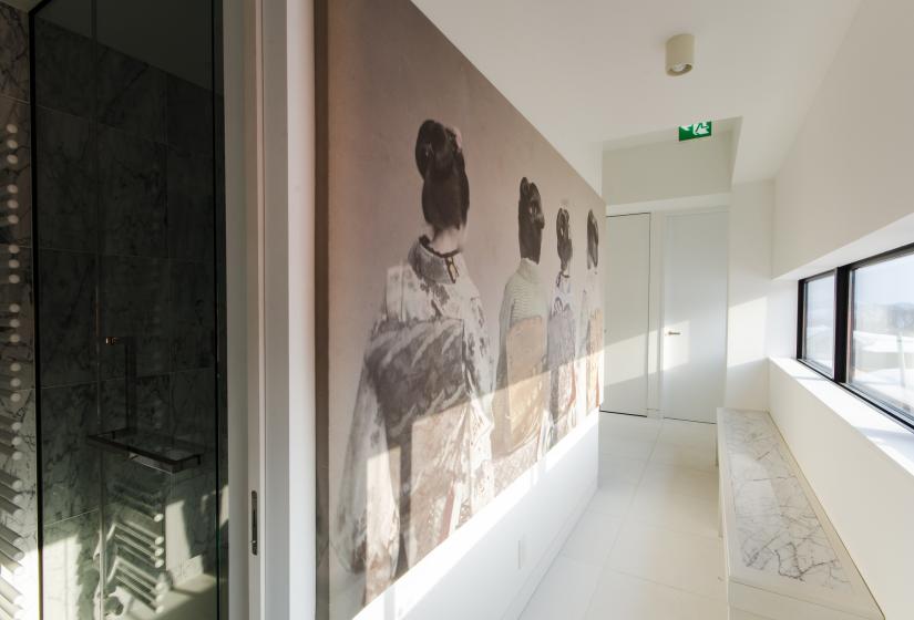 large photo of women wearing kimono decorates the hallway