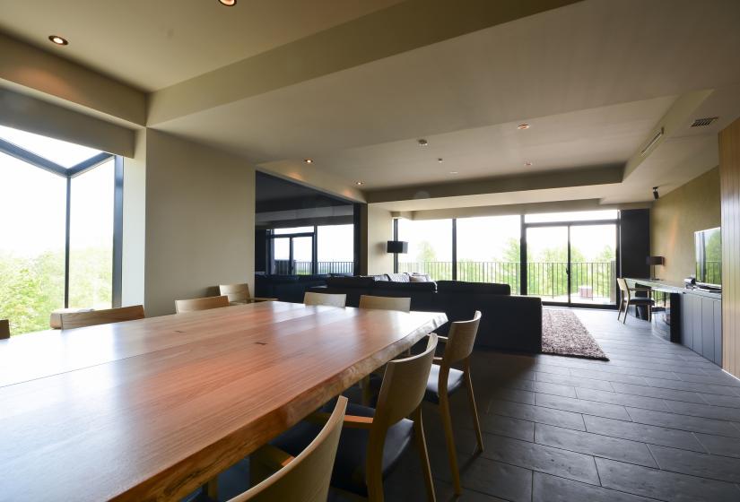 length of dining table with living area in the background