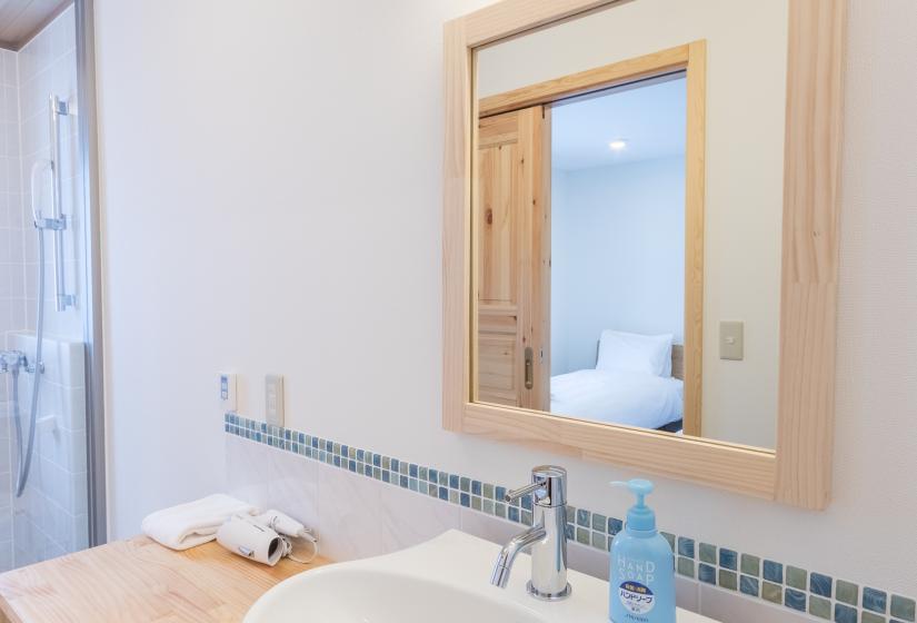 Lodge Mori bathroom basin, mirror, and hand soap