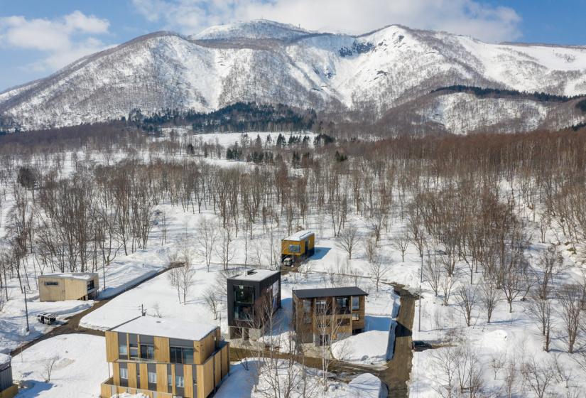 aerial view of building and mountains in winter