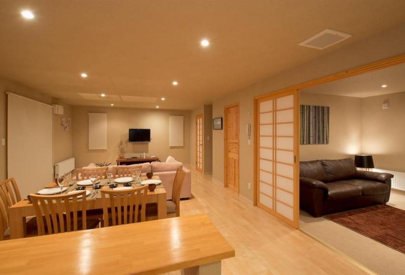 Dining area with shoji doors and living room couches