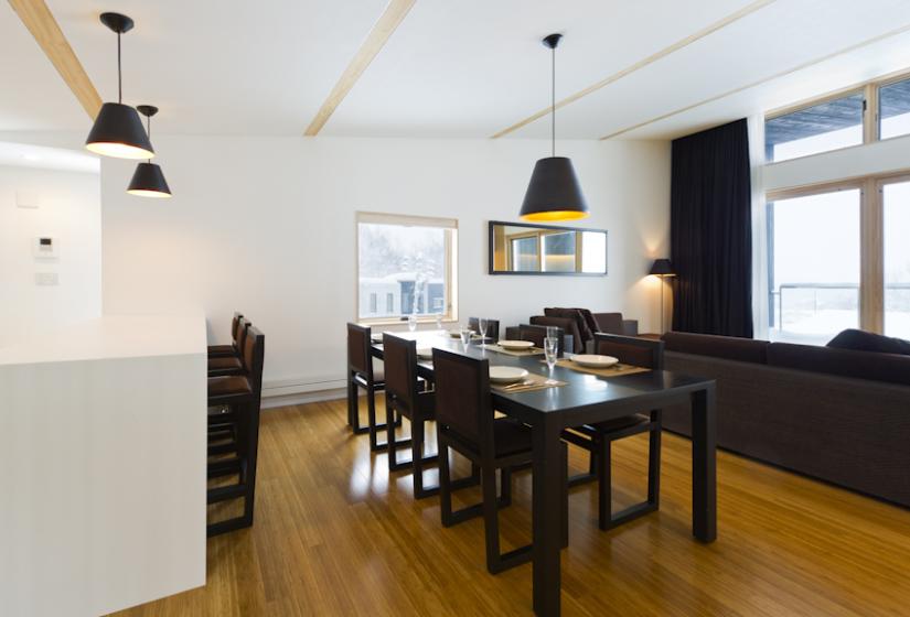 dining table centred between the living area and kitchen