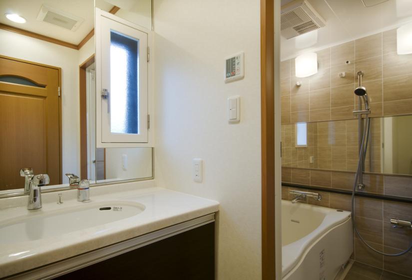 washroom sink and tub view