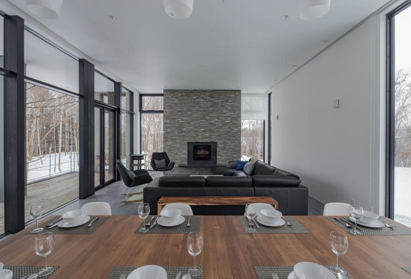 dining area with couches and fireplace