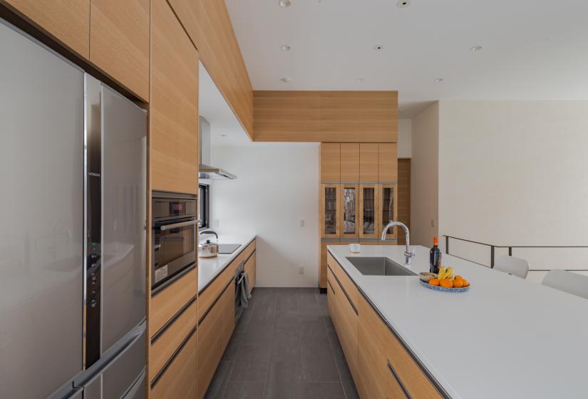 kitchen counter and cooking space with wooden drawers