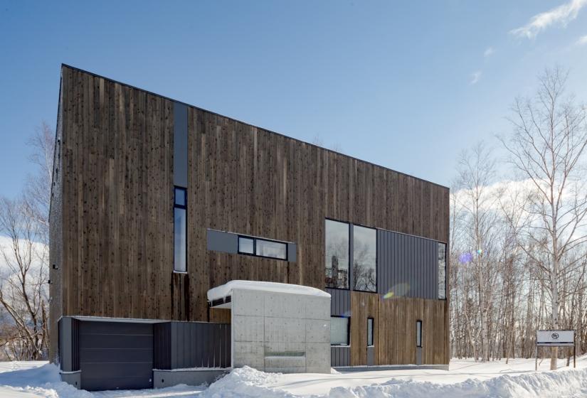 exterior of building with concrete roof over entrance in winter