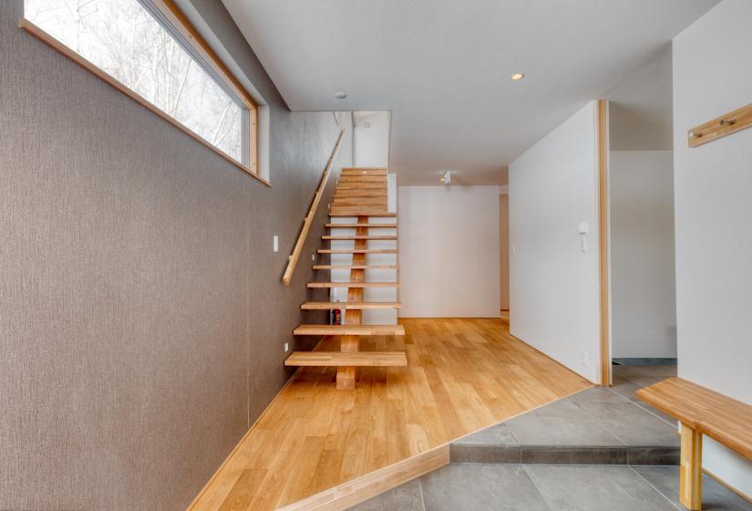 entrance and stairway with wood flooring