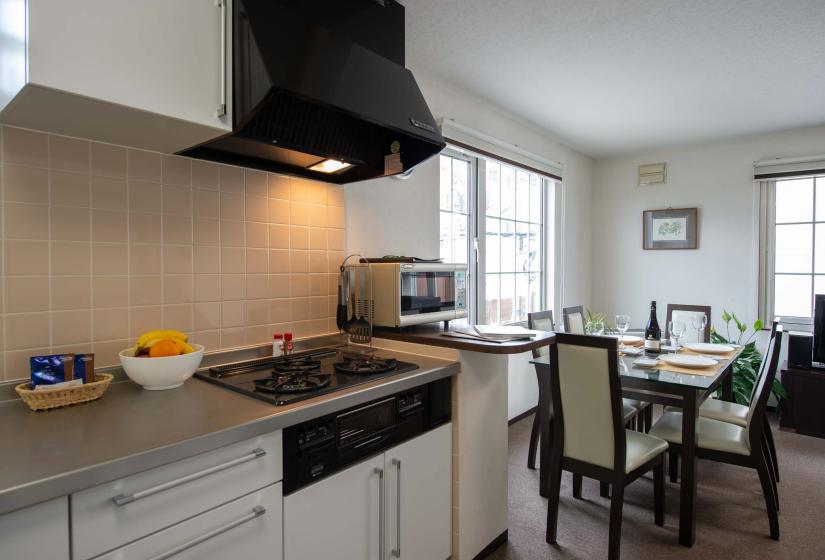 oven cook top with dining table in background