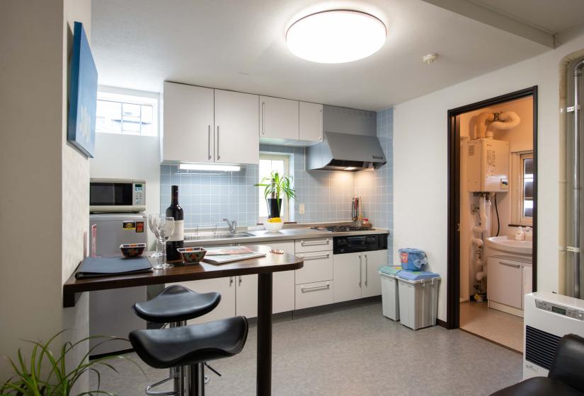 counter table with wine bottle and two stools