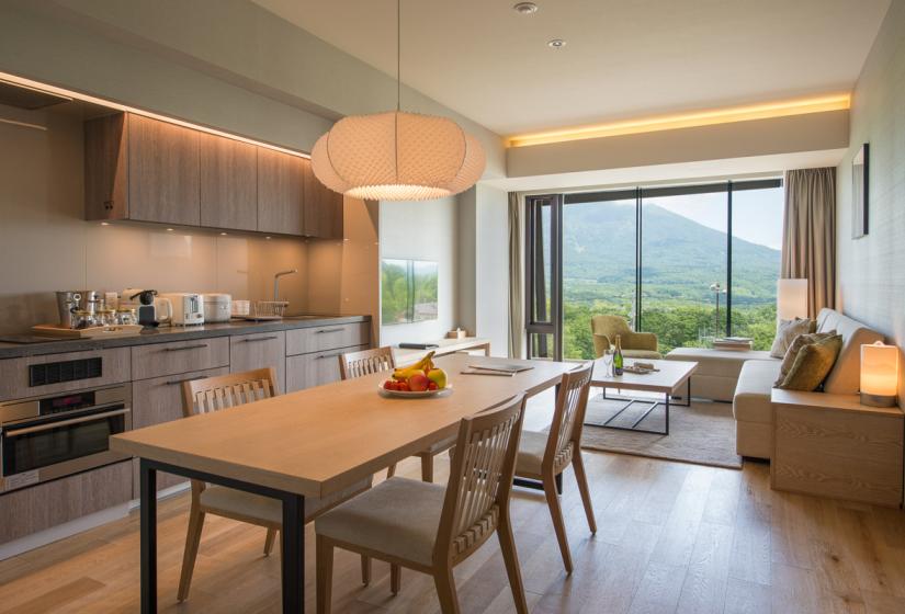 dining table with open plan kitchen