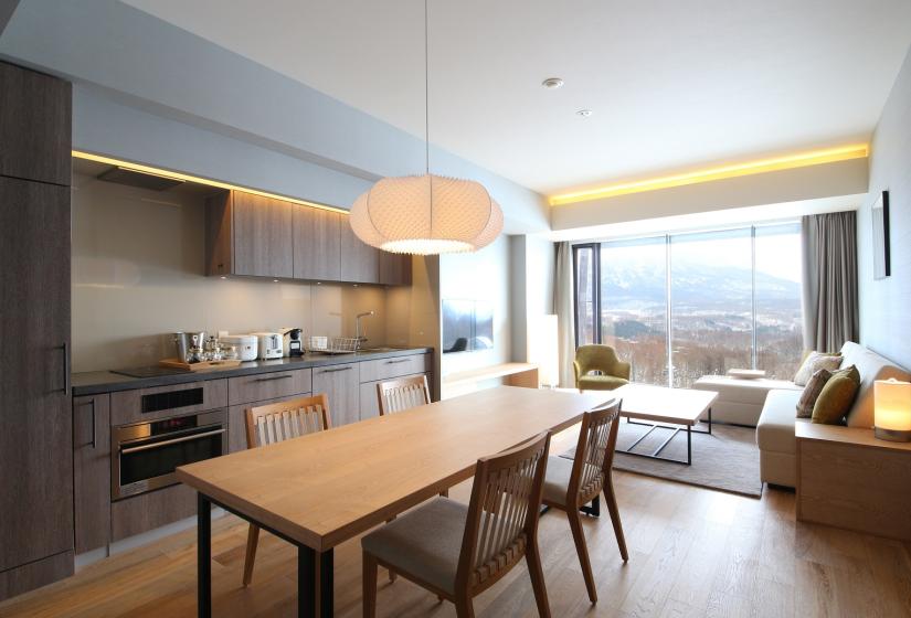 dining table with open plan kitchen