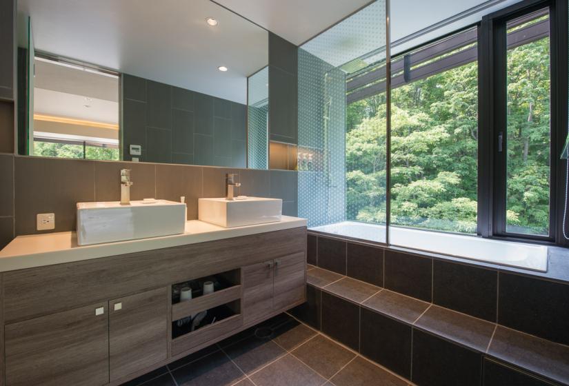 brown vanity unit with window and tree view