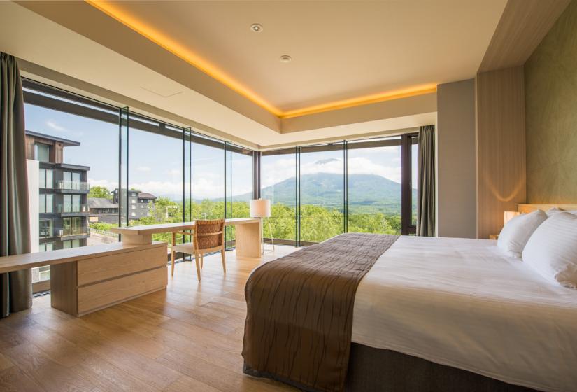 Double bed with summer mountain view