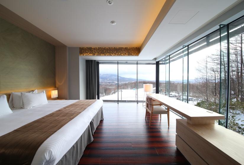 bed view with wooden floor