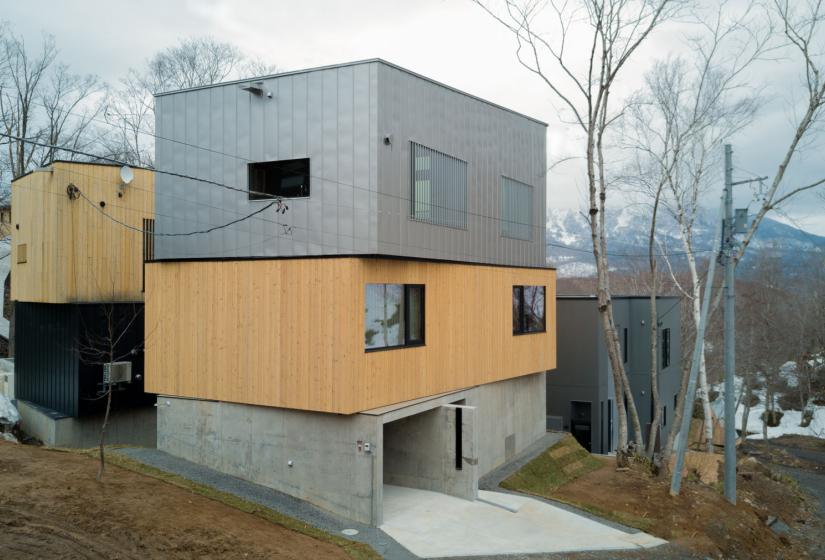 exterior of building with garage and concrete driveway