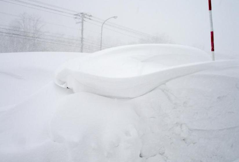Hiromi's car is under that snow- marked with a pole