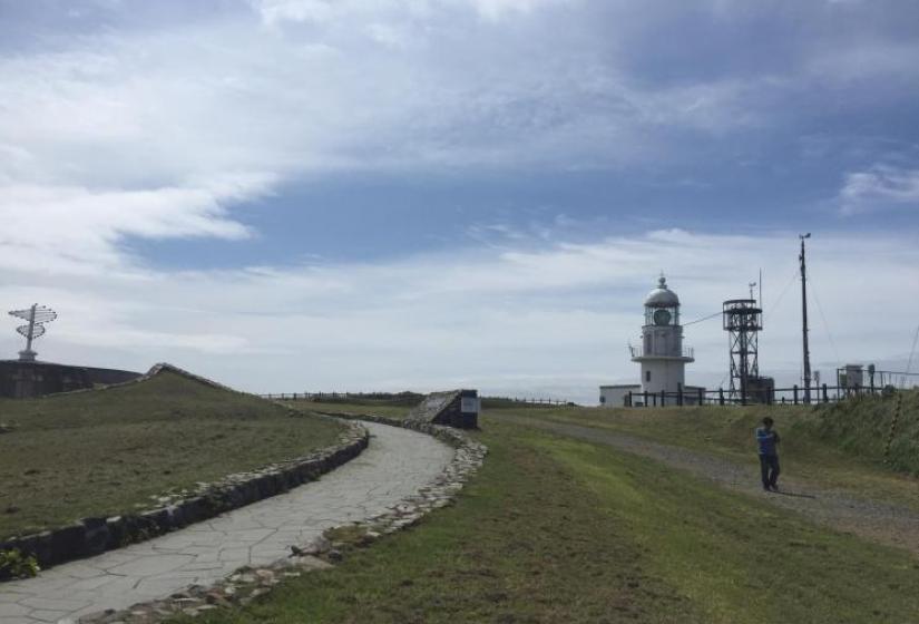 A functioning lighthouse at Erimo Misaki A light house and pathway