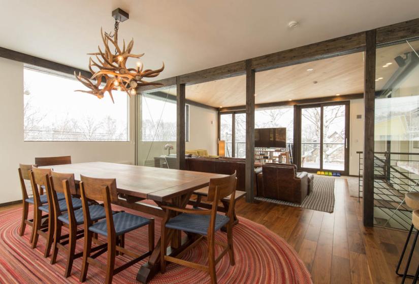 dining table with couches and TV in background