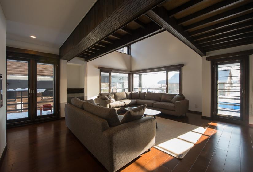 light brown sofas placed around a coffee table in the living room