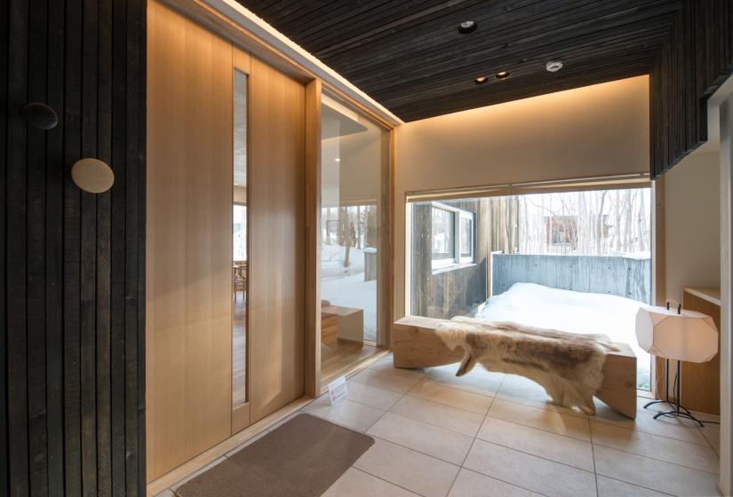 foyer with bench and large window