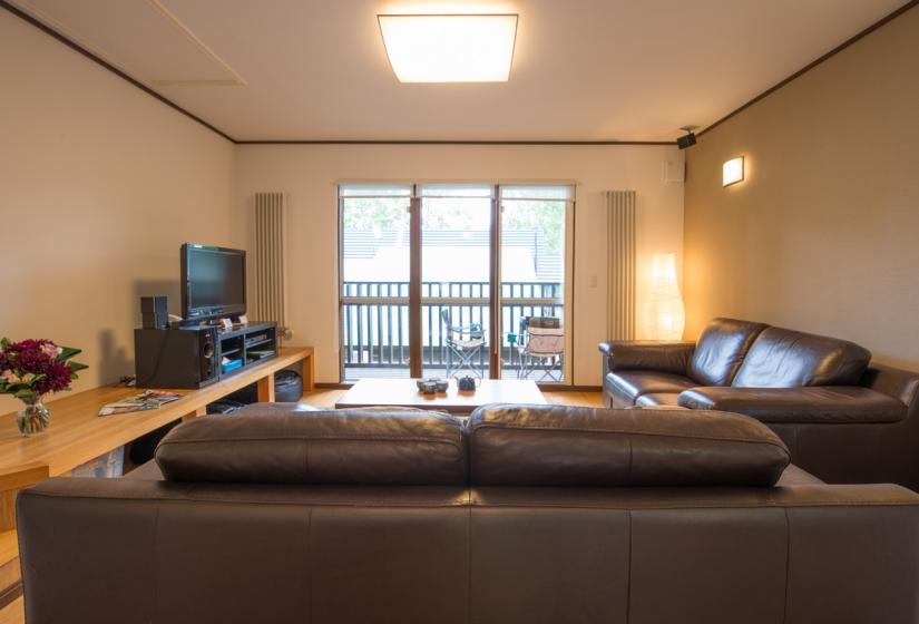 Living area with TV and balcony