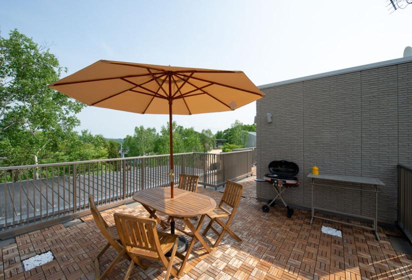 Picnic table and chairs on roof top terrace