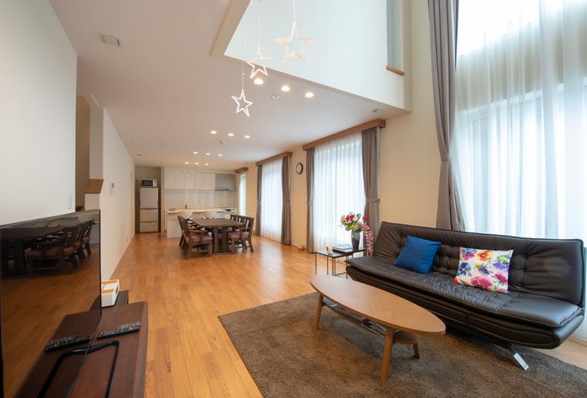 living area with black sofa