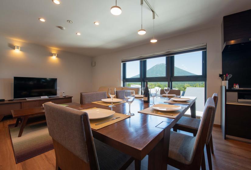 Dining table with view of volcano through windows