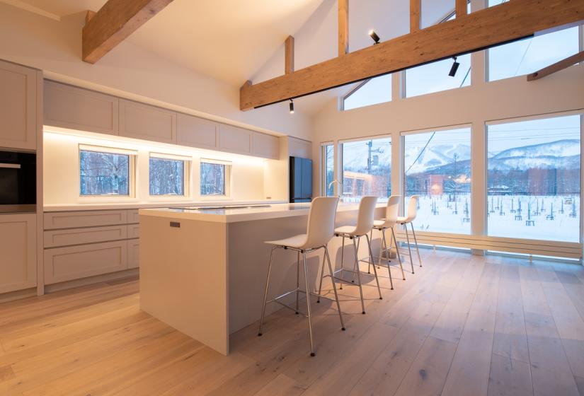 kitchen with white bar seats