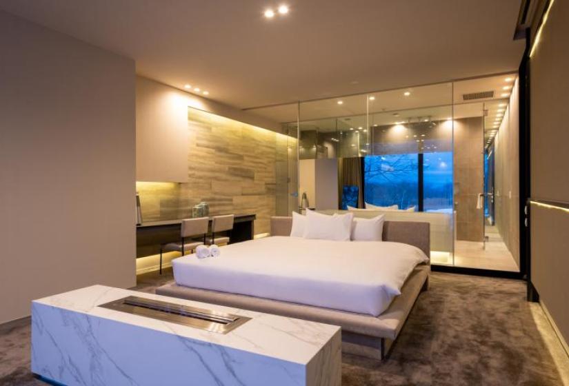 The luxurious master bedroom A large double bed in an opulent master suite