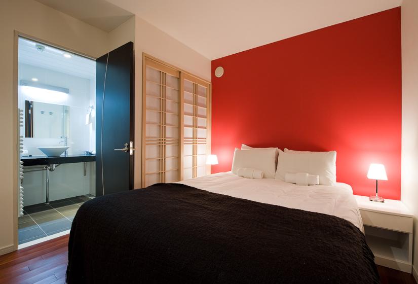 Bedroom with red wall paper