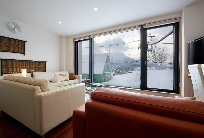 Red sofa, snowy view out of window